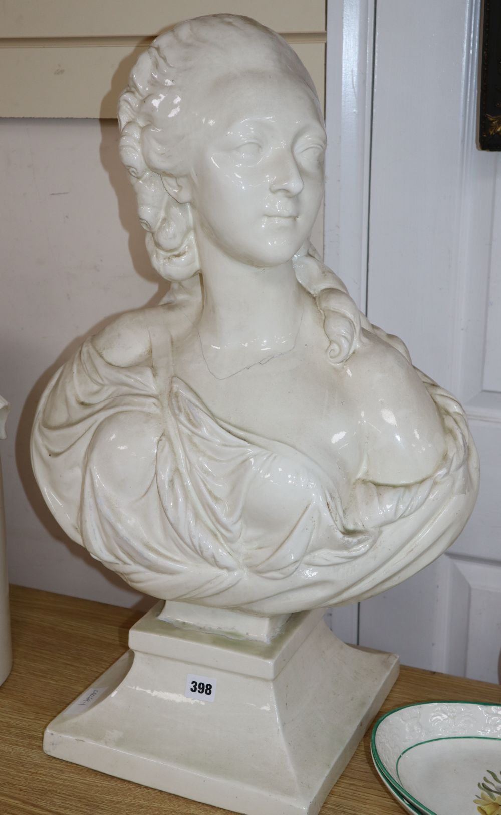 A white glazed ceramic bust of a lady, height 68cm (a.f.)